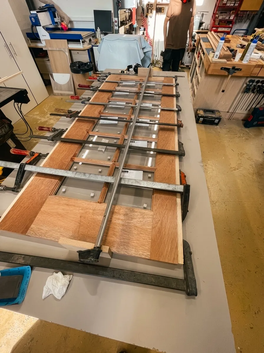Detail of an extending solid oak table joint with extension mechanism and metal runners